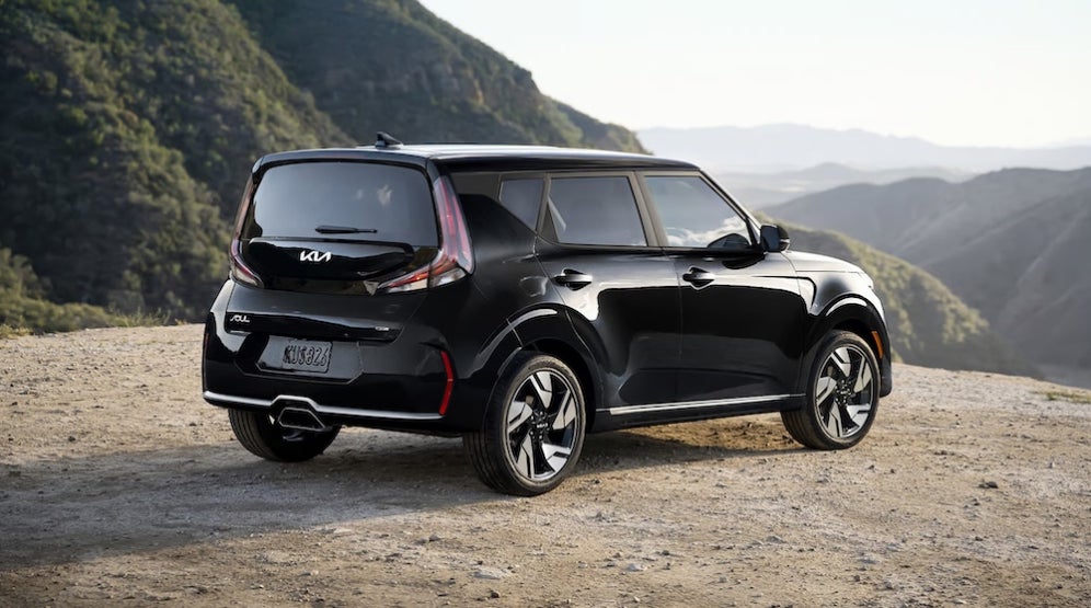 A black 2026 Kia Soul SUV parked overlooking mountains